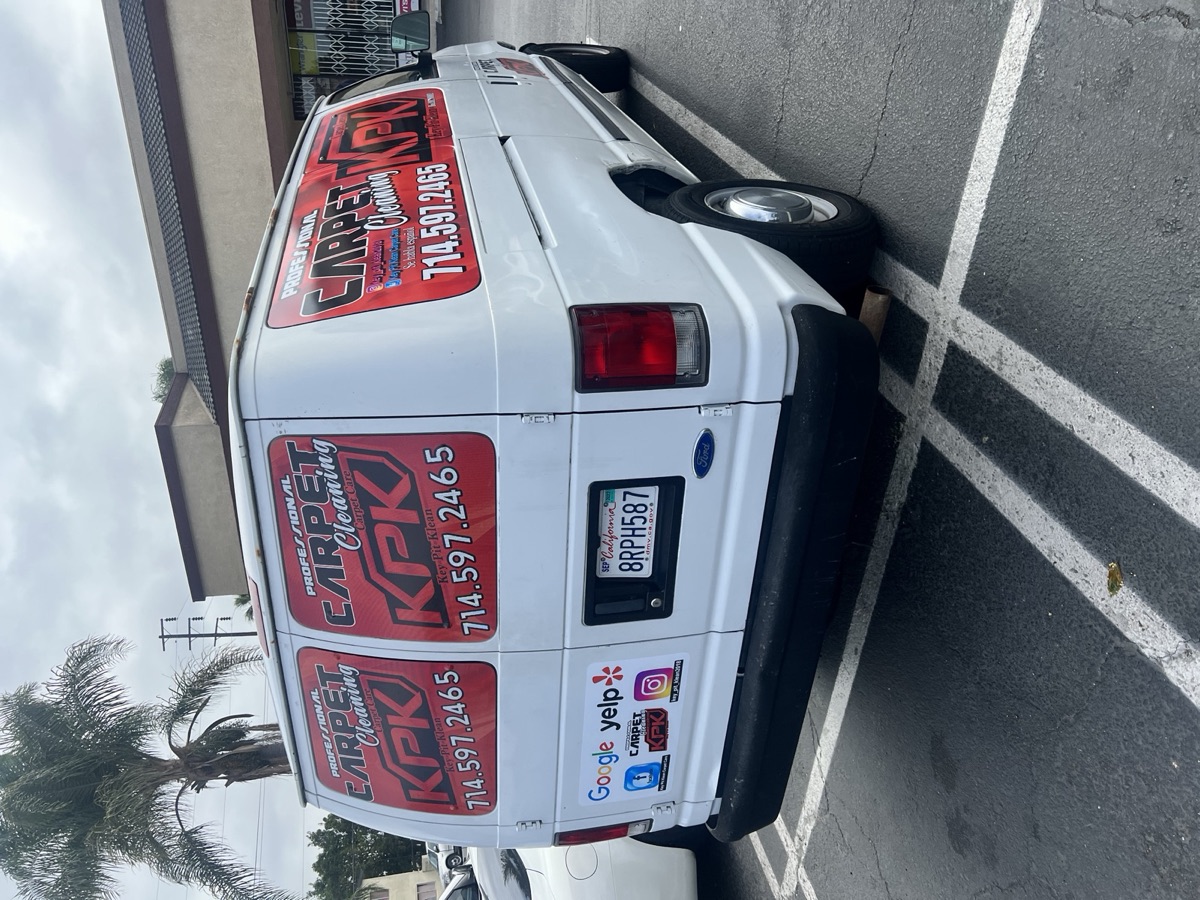 KPK carpet cleaning service van parked at a job