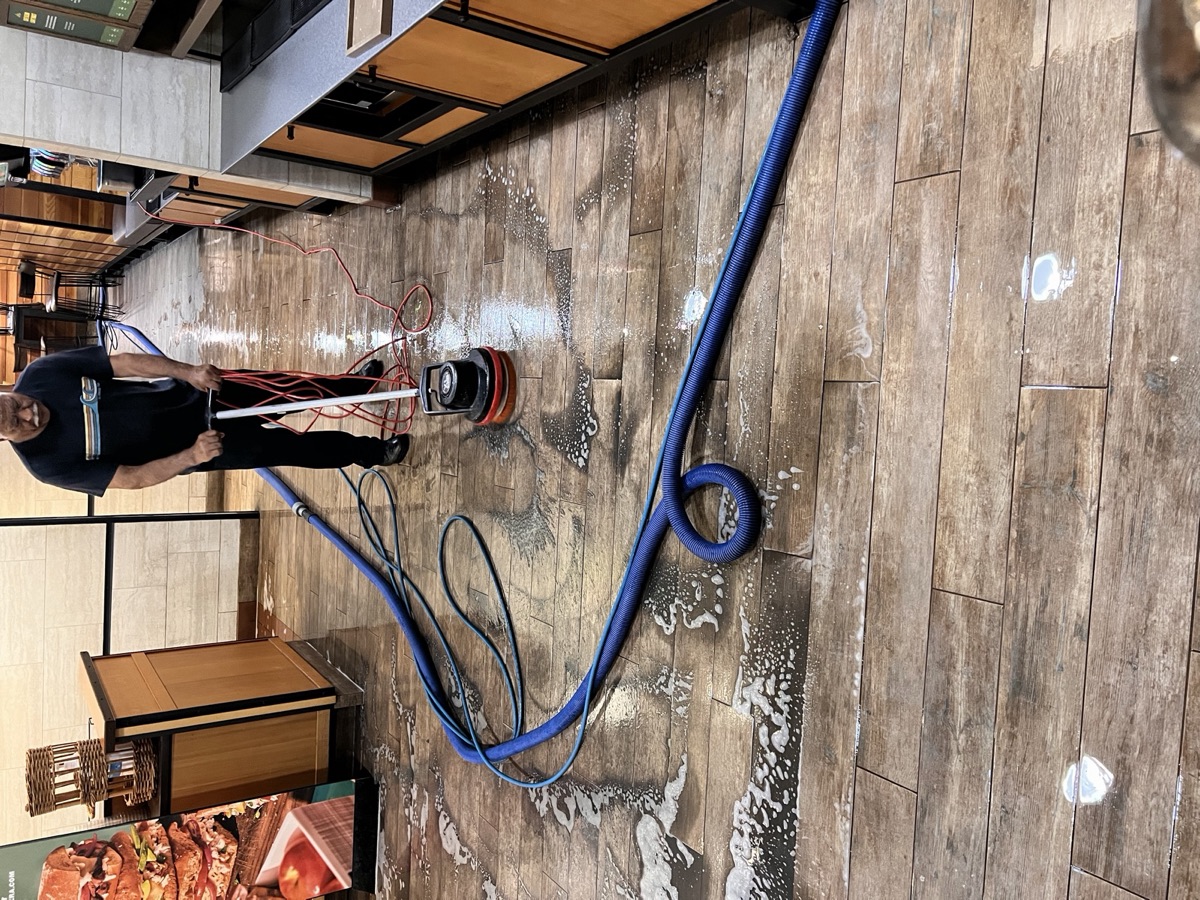 Commercial tile floor deep-clean in progress